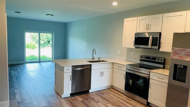 a kitchen with a stove and a microwave