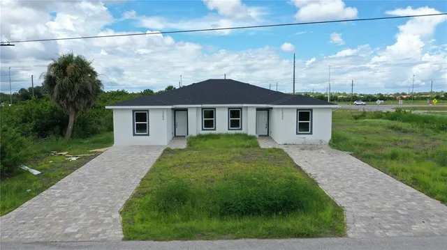 a view of an outdoor space pool patio and lake view