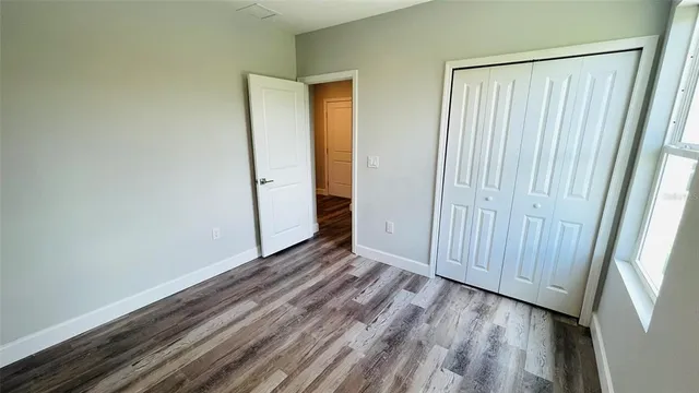 a view of a small space with wooden floor