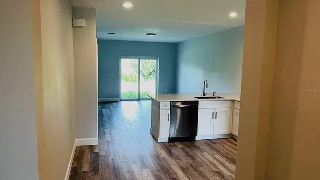 a kitchen with a sink and a stove top oven