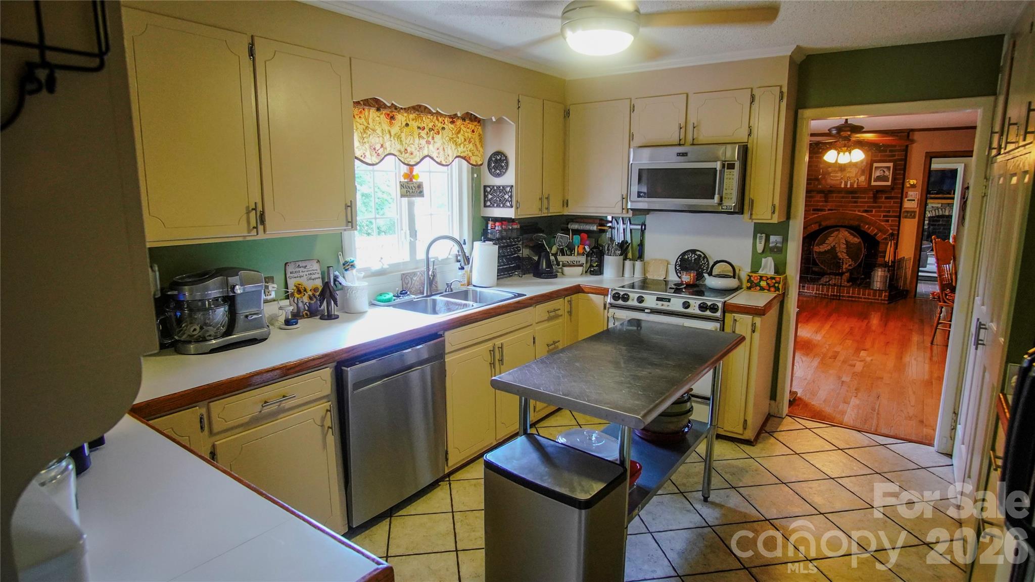 204 Old Stage Coach Road Lawndale, NC 28090 - Photo 16 of 30 a kitchen with a sink a stove and cabinets