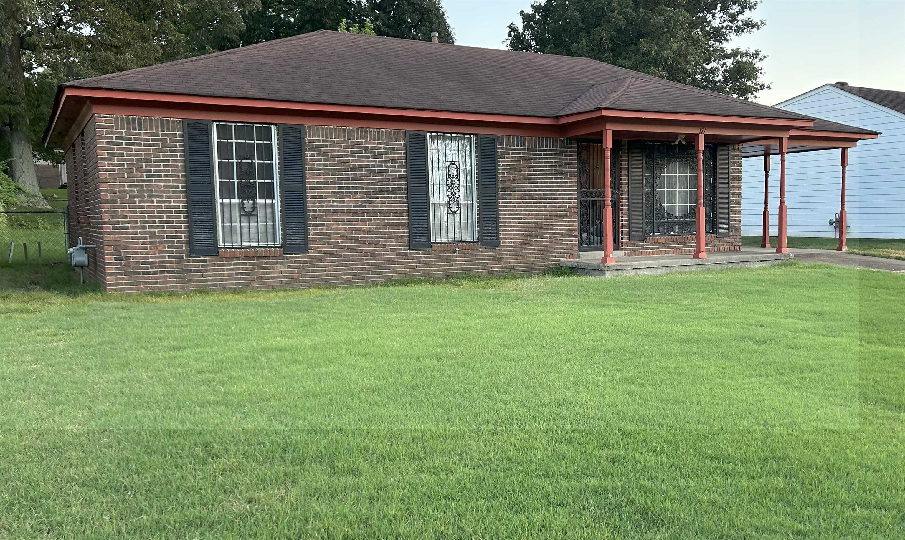 171 Loraine Road Memphis, TN 38109 - Photo 2 of 12 a front view of a house with garden