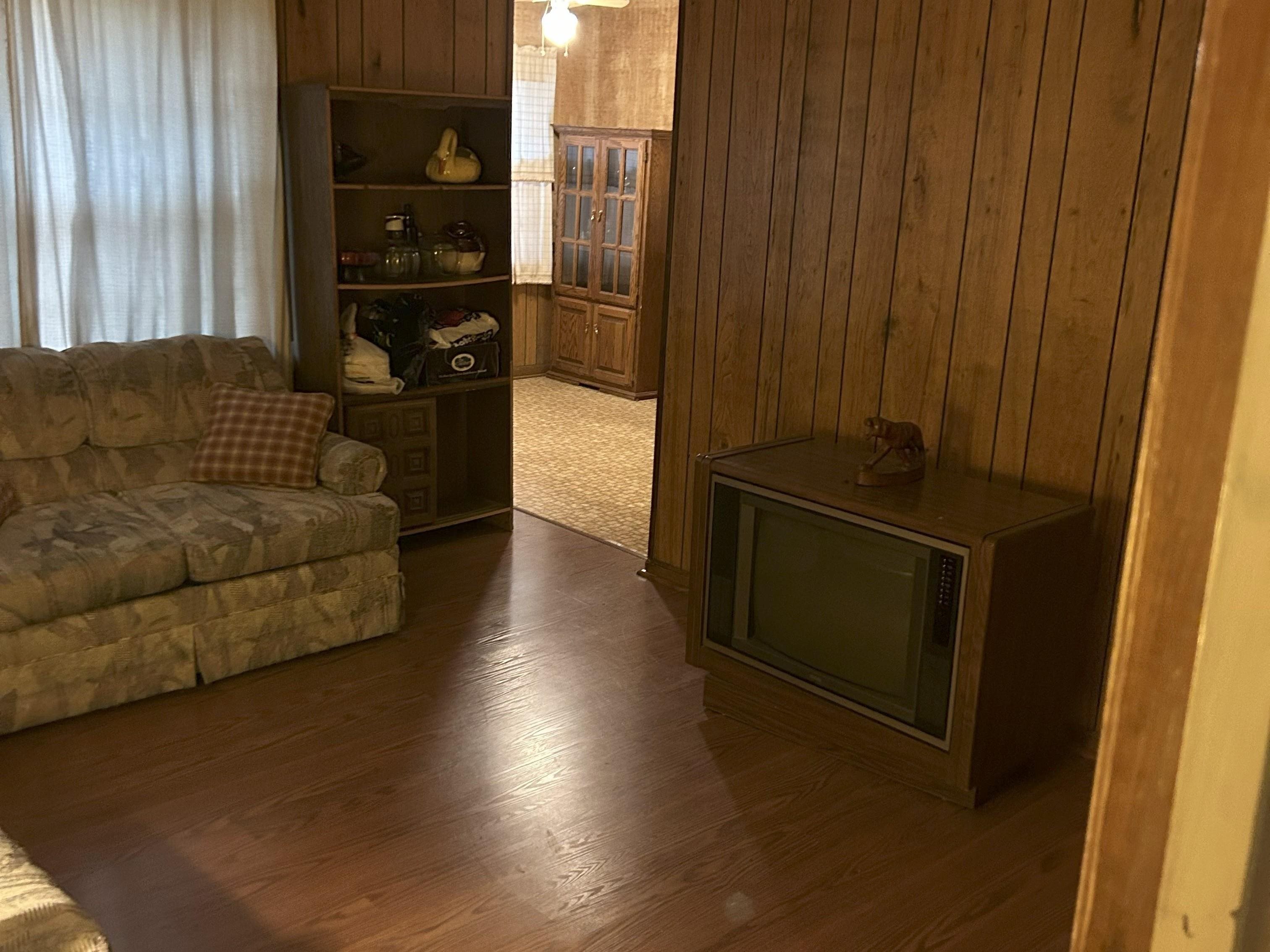 171 Loraine Road Memphis, TN 38109 - Photo 5 of 12 a living room with furniture and a gate