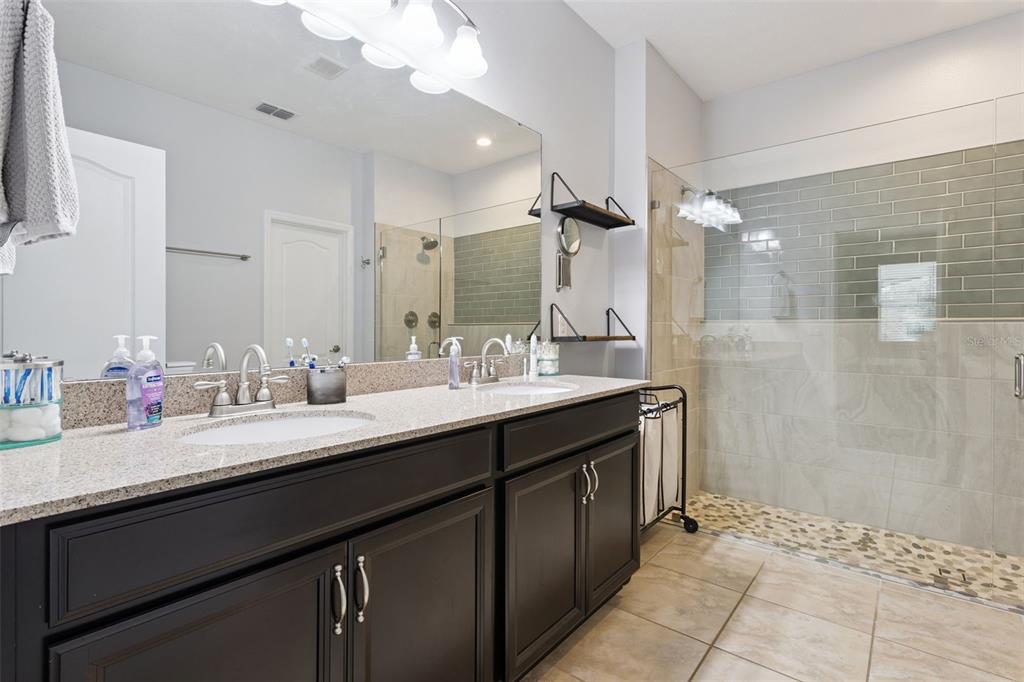 2400 Artist Point Court Apopka, FL 32703 - Photo 18 of 50 a bathroom with a sink double vanity and a mirror