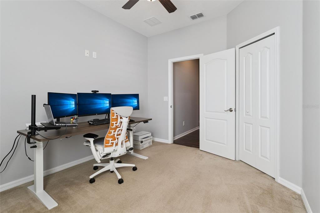 2400 Artist Point Court Apopka, FL 32703 - Photo 25 of 50 a view of a workspace with furniture and a ceiling fan