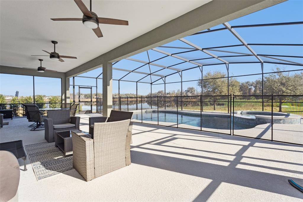 2400 Artist Point Court Apopka, FL 32703 - Photo 28 of 50 a view of a dining room with furniture water view and a floor to ceiling window