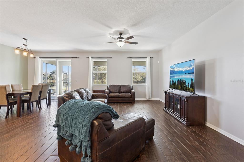 2400 Artist Point Court Apopka, FL 32703 - Photo 6 of 50 a living room with furniture and a flat screen tv