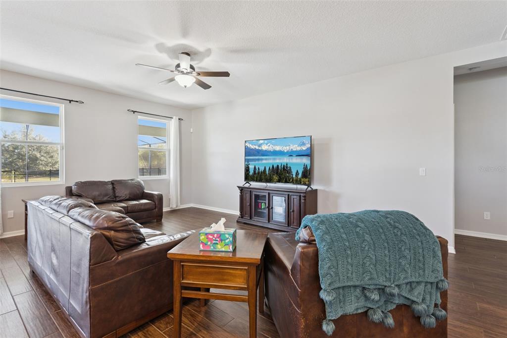 2400 Artist Point Court Apopka, FL 32703 - Photo 7 of 50 a living room with furniture and a window