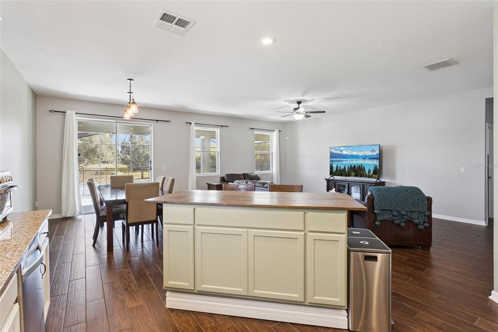 2400 Artist Point Court Apopka, FL 32703 - Photo 10 of 50 a view of a dining room with furniture window and wooden floor