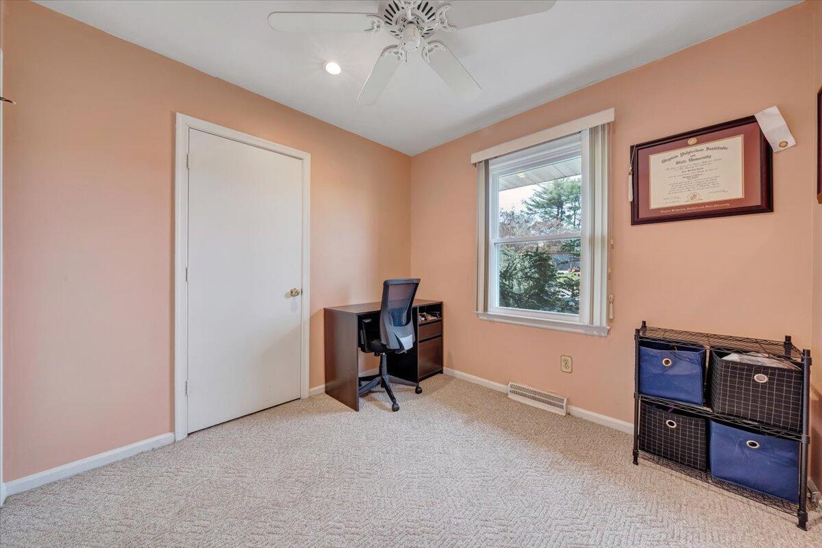 548 Holiday Road Vinton, VA 24179 - Photo 21 of 56 a view of a workspace with furniture and a window