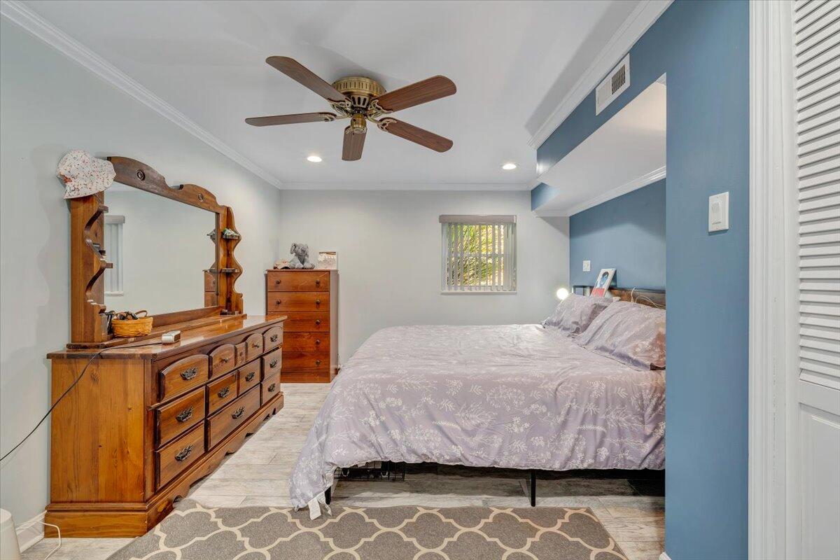 548 Holiday Road Vinton, VA 24179 - Photo 30 of 56 a bedroom with a bed and wooden floor