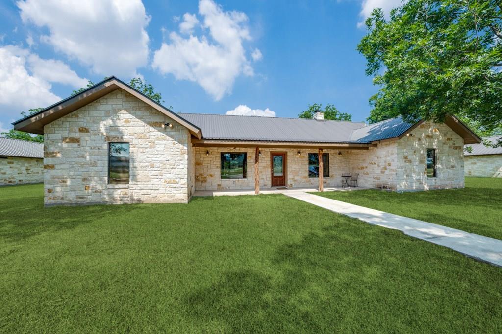 170 Johhny Seibert Lane Rio Frio, TX 78879 - Photo 1 of 67 a view of a yard in front of a house with plants and large tree