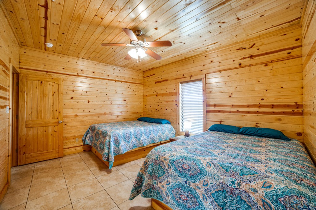 170 Johhny Seibert Lane Rio Frio, TX 78879 - Photo 16 of 67 a bedroom with a bed and a walk in closet