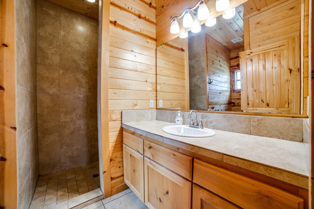 170 Johhny Seibert Lane Rio Frio, TX 78879 - Photo 17 of 67 a bathroom with a sink and a mirror