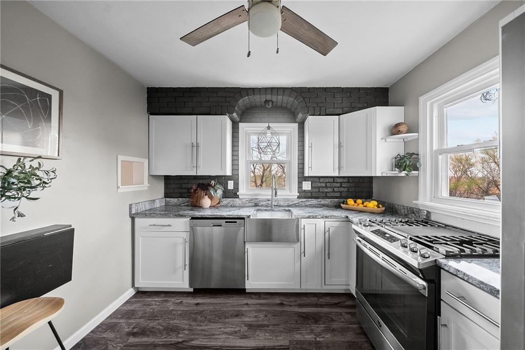 3130 Ridgeway Drive South Park, PA 15129 - Photo 4 of 49 a kitchen with stainless steel appliances granite countertop a stove and a sink