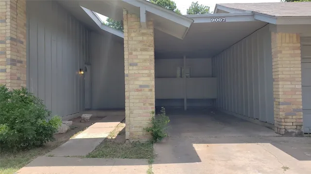 a view of backyard with potted plants