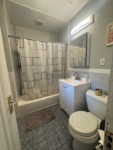 30 Chiswick Road, Unit 5 Boston, MA 02135 - Photo 11 of 12 a bathroom with a sink toilet and shower