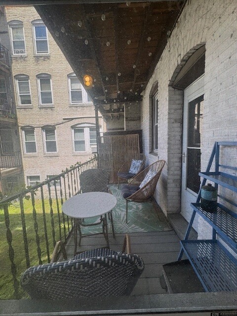 30 Chiswick Road, Unit 5 Boston, MA 02135 - Photo 12 of 12 a view of a chairs and table in a patio