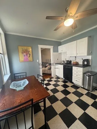 a kitchen with stainless steel appliances a stove a sink and a cabinets