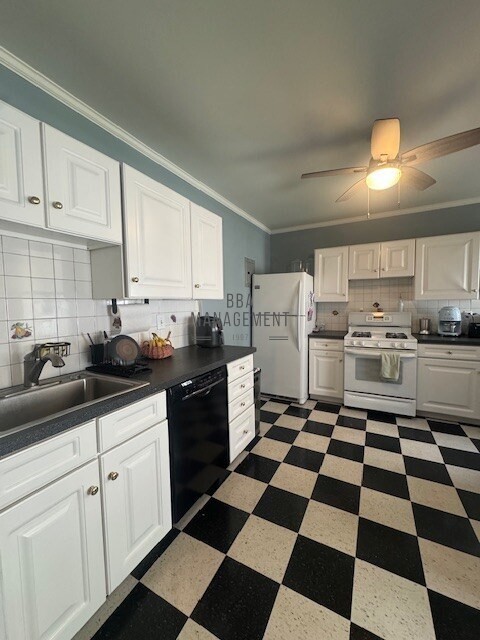 30 Chiswick Road, Unit 5 Boston, MA 02135 - Photo 6 of 12 a kitchen with stainless steel appliances a stove a sink and a cabinets