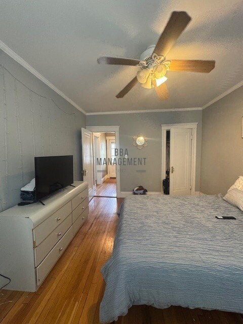 30 Chiswick Road, Unit 5 Boston, MA 02135 - Photo 8 of 12 a bedroom with a bed and flat screen tv