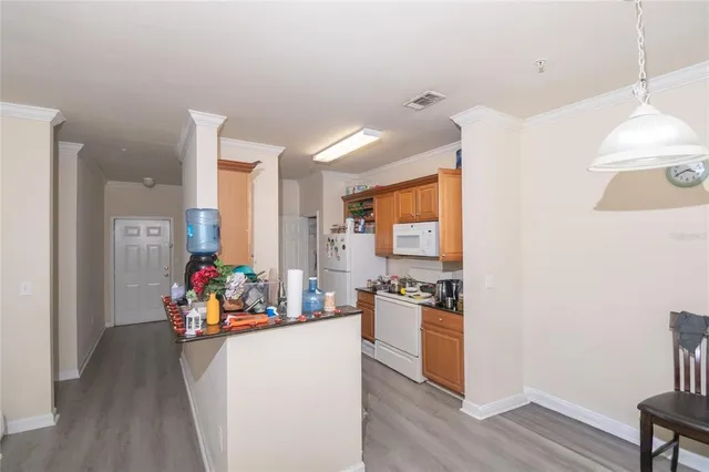 a view of a play room with toys and wooden floor