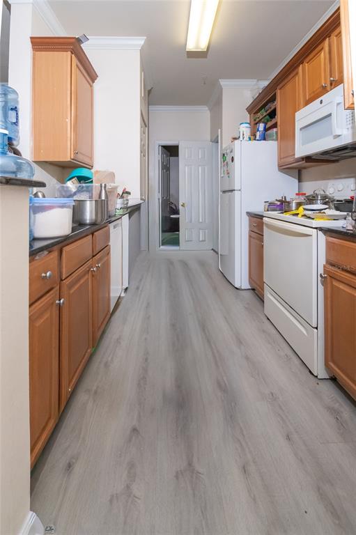18103 Back Stretch Lane Tampa, FL 33647 - Photo 5 of 24 a kitchen with granite countertop cabinets stainless steel appliances a sink and a window