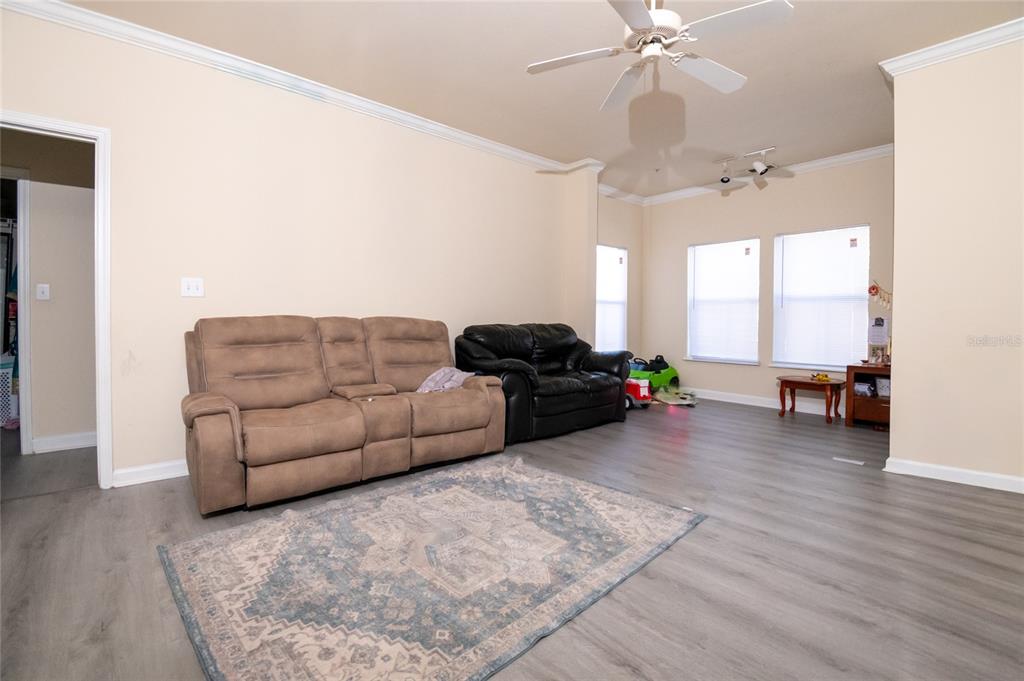 18103 Back Stretch Lane Tampa, FL 33647 - Photo 6 of 24 a living room with furniture and a large window