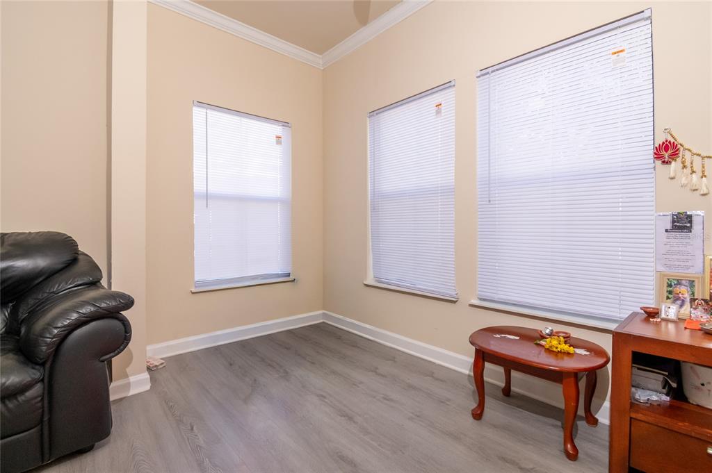 18103 Back Stretch Lane Tampa, FL 33647 - Photo 7 of 24 a living room with furniture and a window