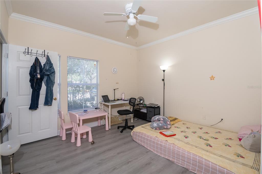 18103 Back Stretch Lane Tampa, FL 33647 - Photo 10 of 24 a bedroom with a bed and a window