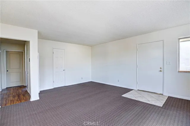 a kitchen with a stove a sink and a refrigerator