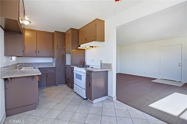 a view of a room with wooden floor and window