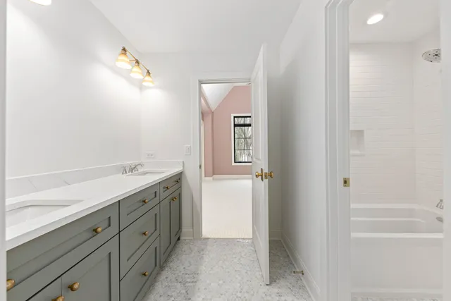 a bathroom with a toilet a sink and bathtub