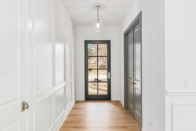 a view of a room with wooden floor and windows