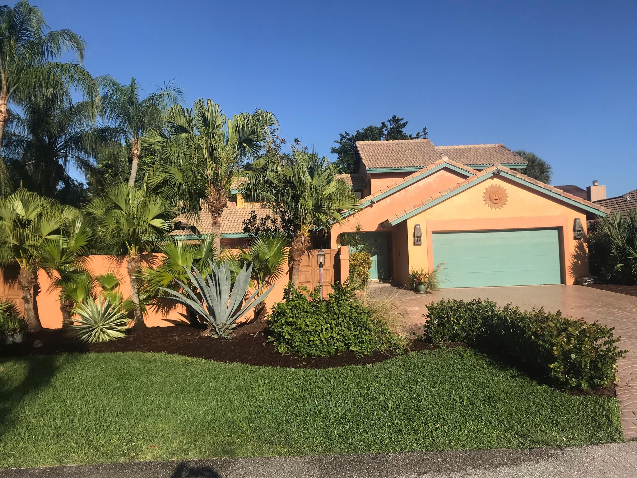 22701 Bella Rita Circle Boca Raton, FL 33433 - Photo 1 of 24 a front view of a house with a yard