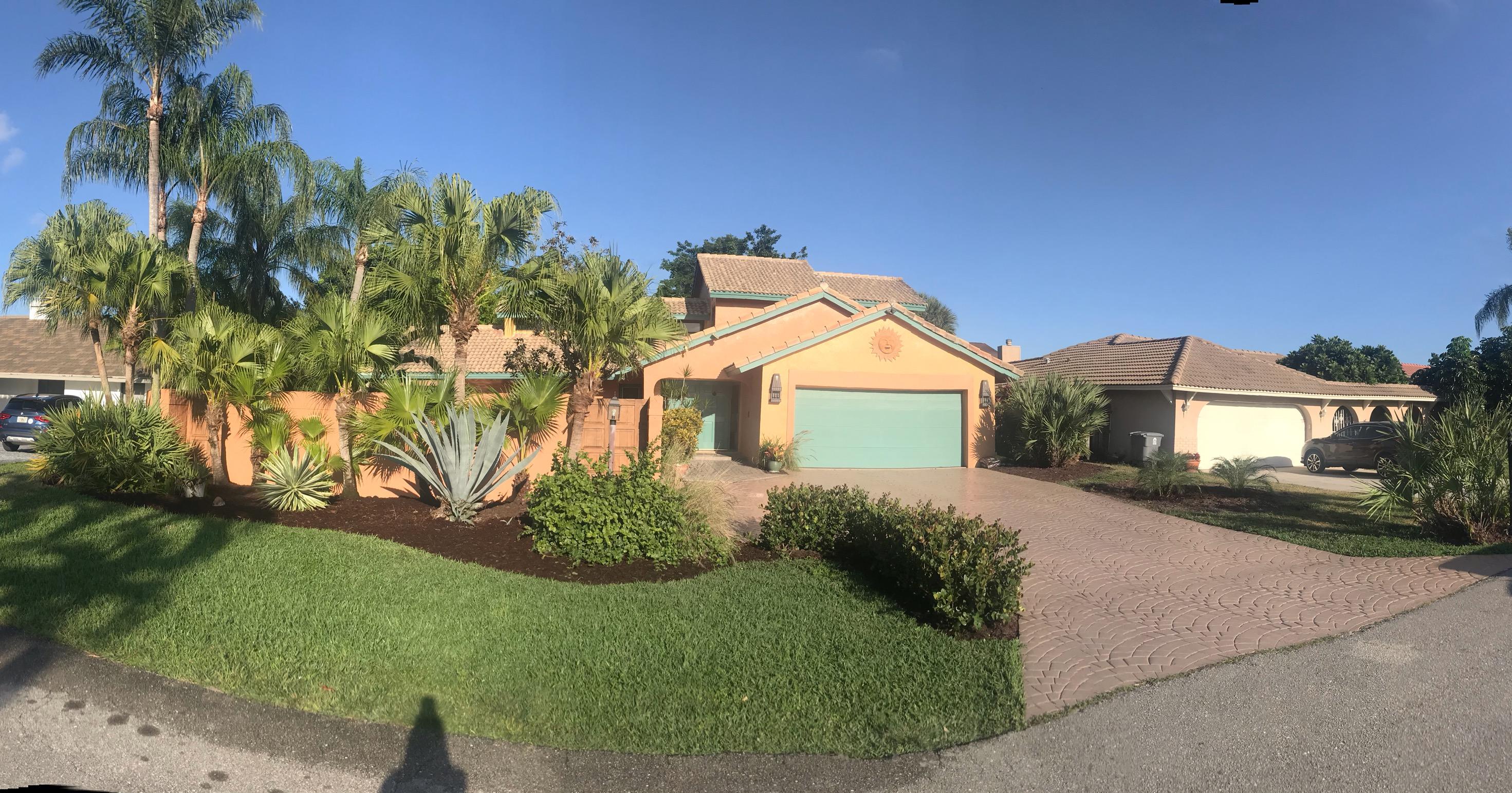 22701 Bella Rita Circle Boca Raton, FL 33433 - Photo 3 of 24 a front view of a house with a yard