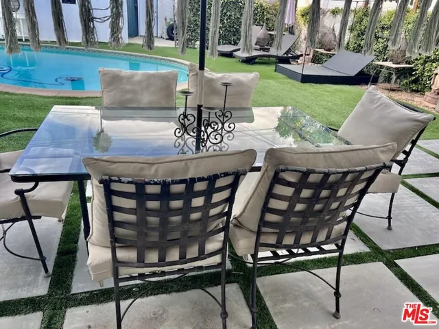 a view of an outdoor sitting area with furniture