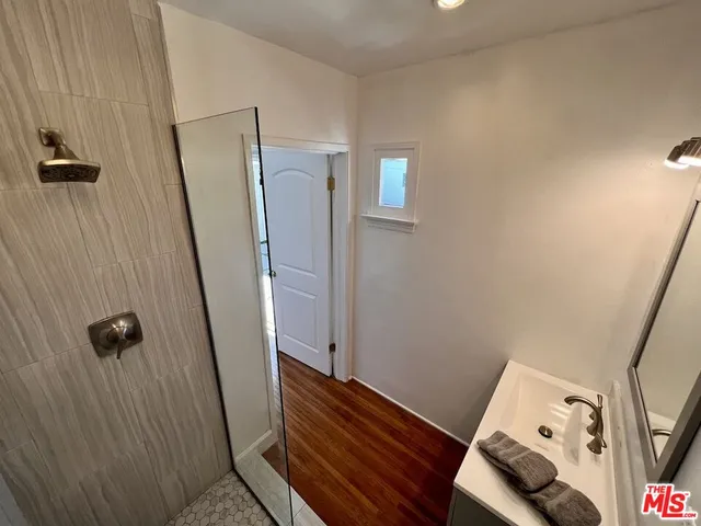 a bathroom with a sink and shower curtain
