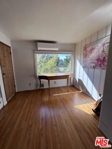 a view of livingroom with furniture wooden floor and window
