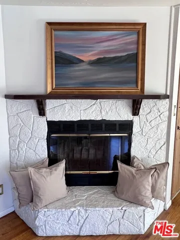 a living room with a couch and a fireplace