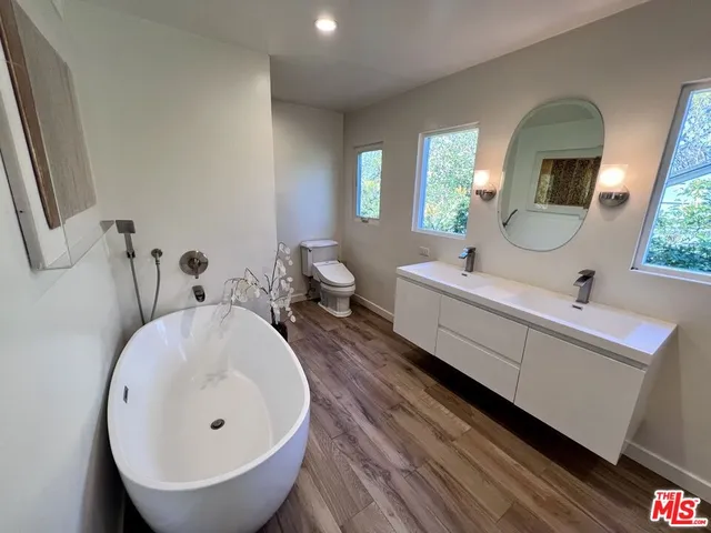 a bathroom with 2 sink and a mirror