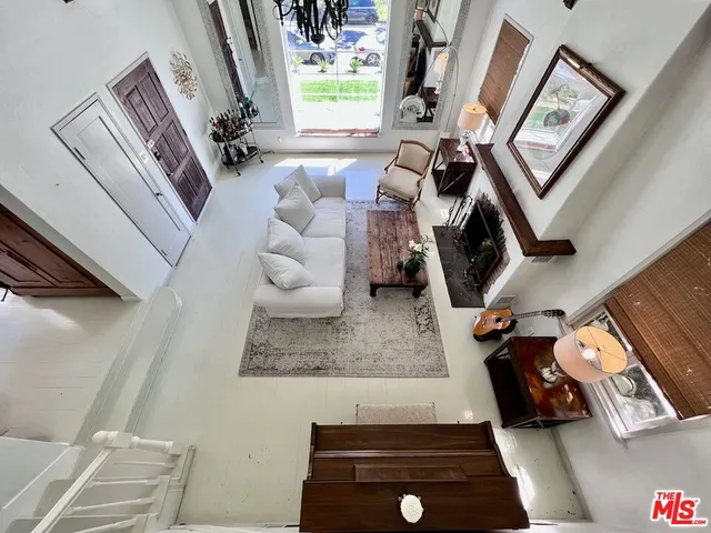 a view of living room with furniture and a window