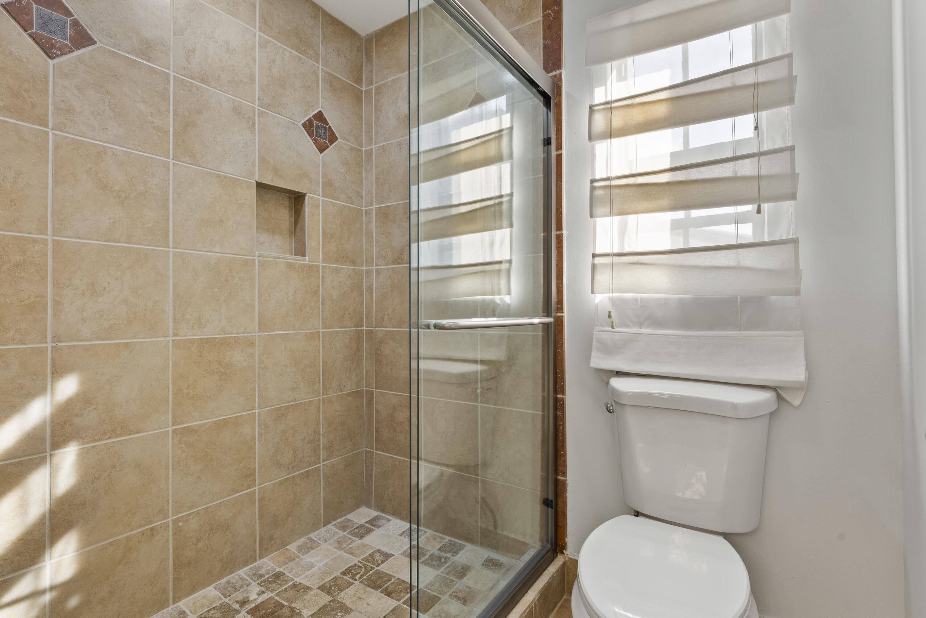 2900 Olivewood Terrace, Unit 2010 Boca Raton, FL 33431 - Photo 14 of 22 a bathroom with a toilet and a shower