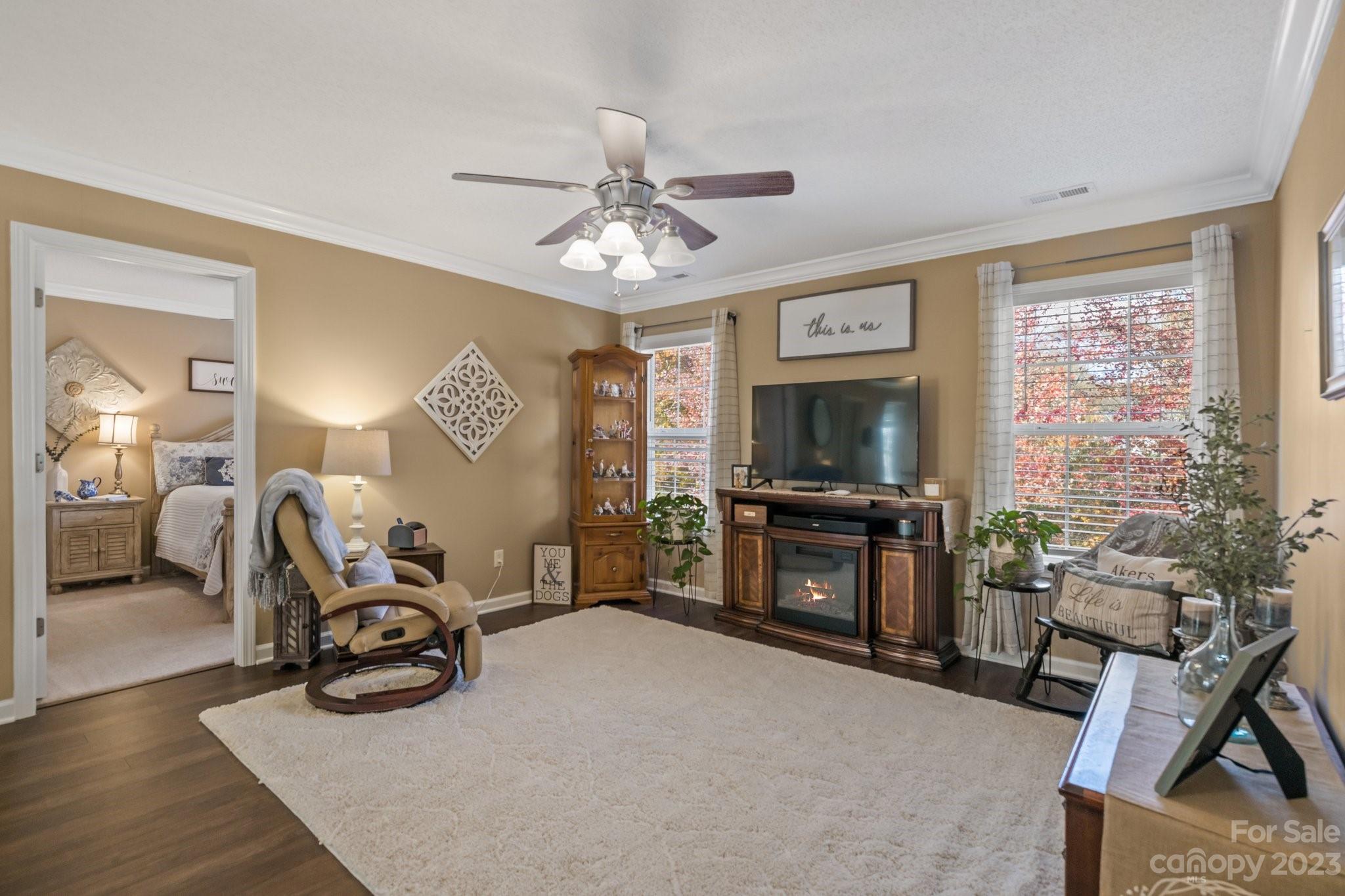 101 Woodfern Road Fletcher, NC 28732 - Photo 21 of 38 a living room with furniture a window and a flat screen tv