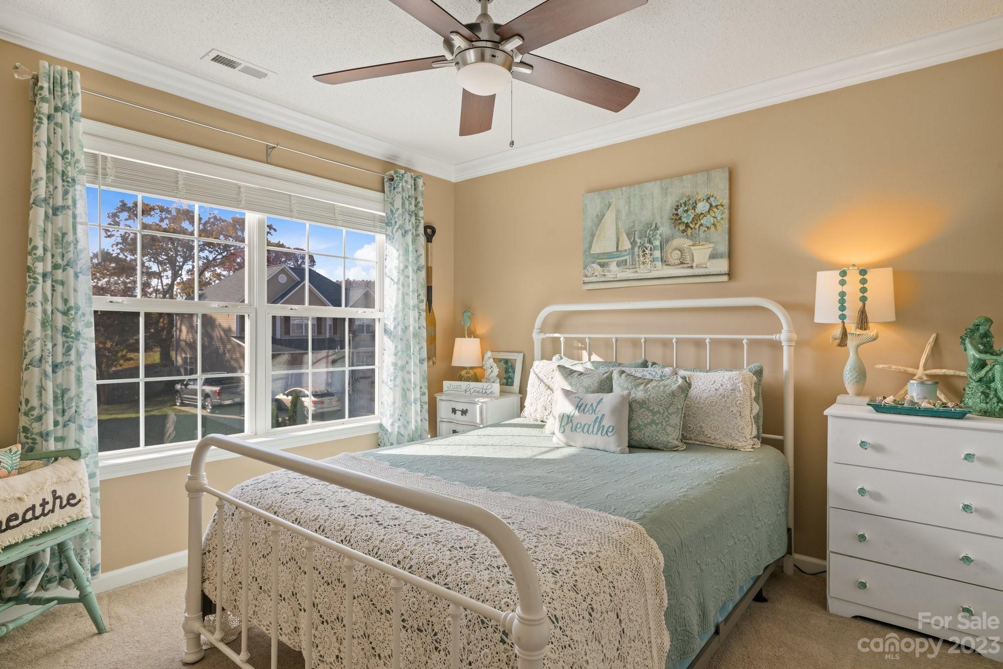 101 Woodfern Road Fletcher, NC 28732 - Photo 23 of 38 a bedroom with a bed and a window