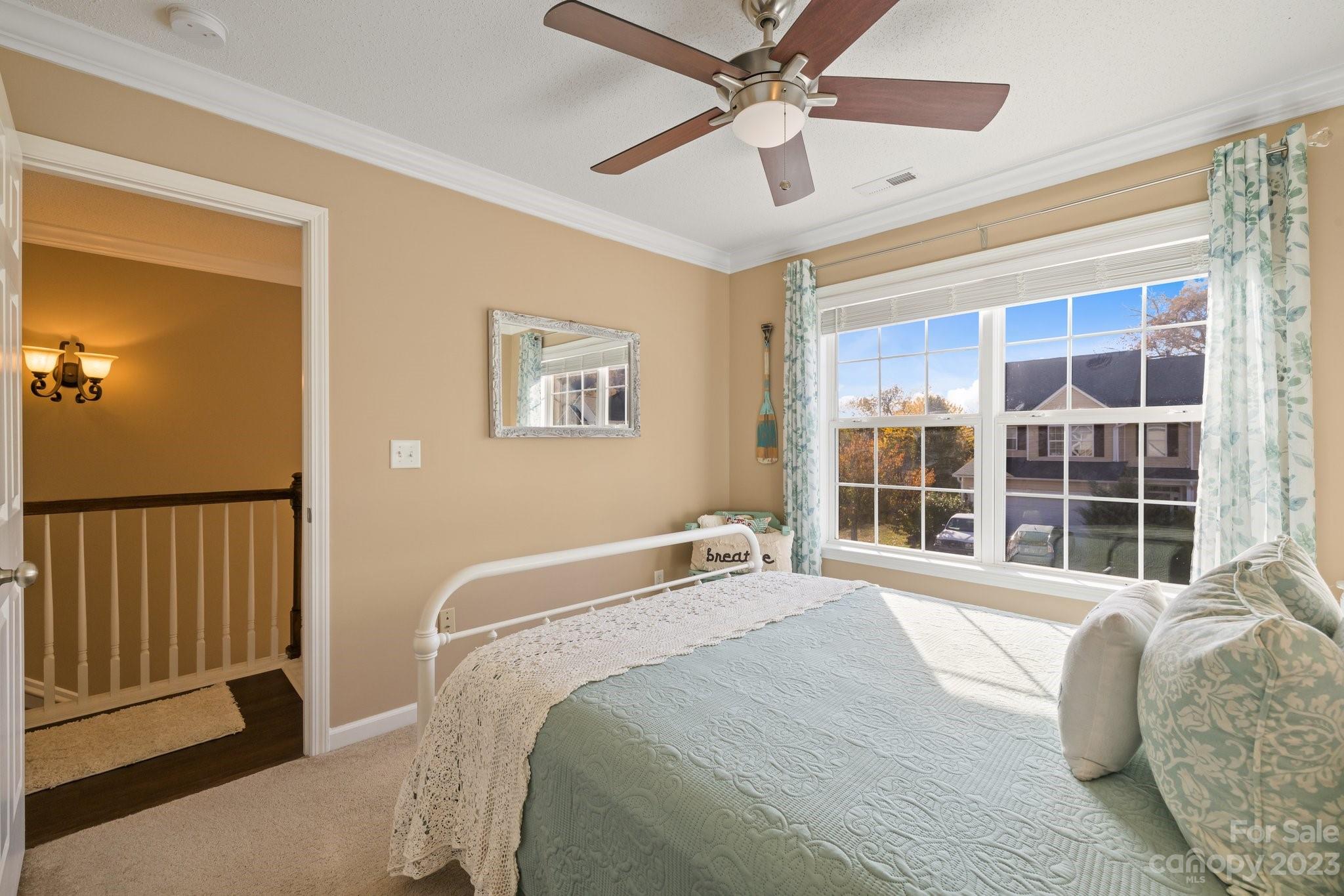 101 Woodfern Road Fletcher, NC 28732 - Photo 24 of 38 a bedroom with a bed and a large window