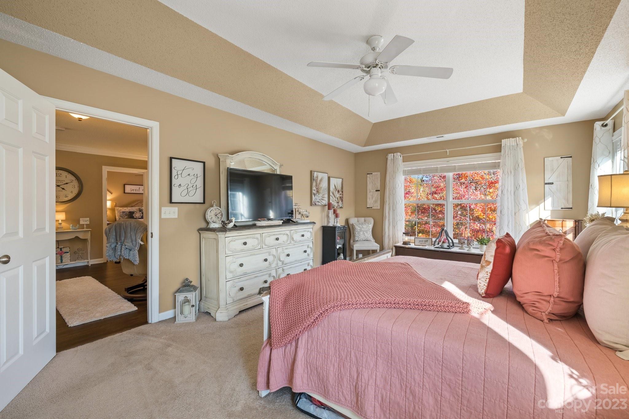 101 Woodfern Road Fletcher, NC 28732 - Photo 27 of 38 a bed room with a bed a television and dresser