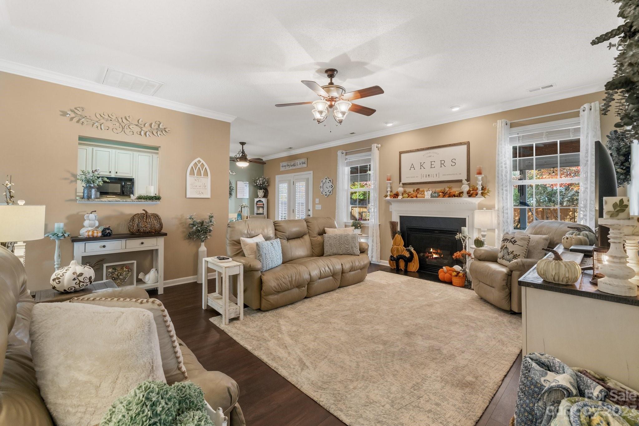 101 Woodfern Road Fletcher, NC 28732 - Photo 3 of 38 a living room with furniture a fireplace and a flat screen tv