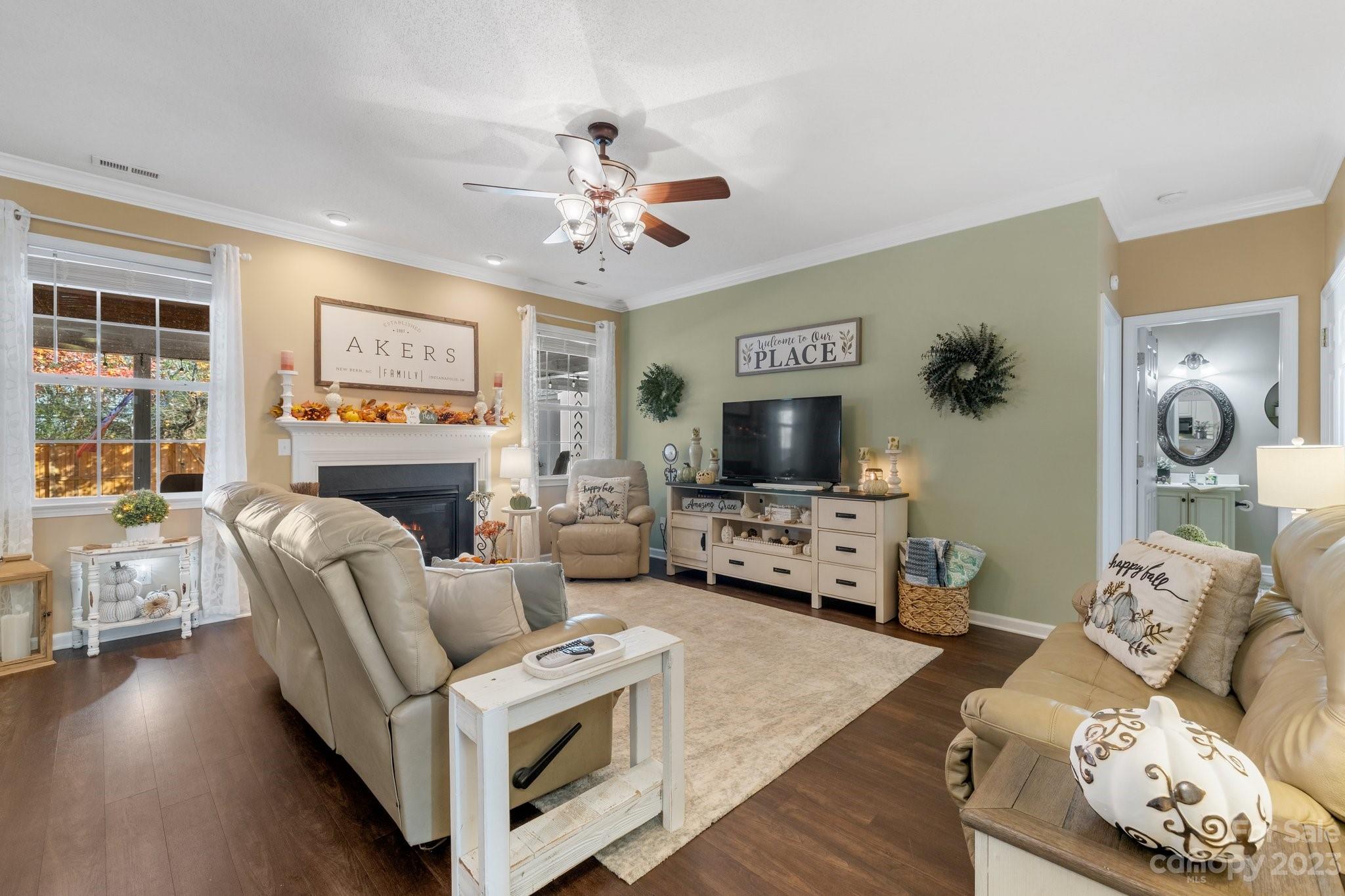 101 Woodfern Road Fletcher, NC 28732 - Photo 5 of 38 a living room with furniture a flat screen tv and a fireplace