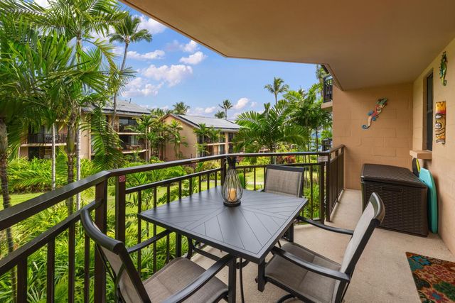a view of a balcony with furniture